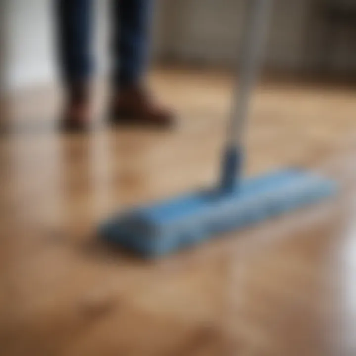 Person using a microfiber mop on laminate flooring