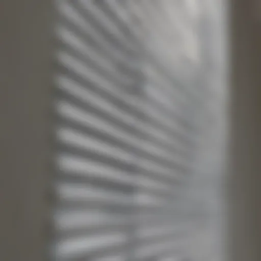 A close-up of clean, pristine window blinds with sunlight filtering through