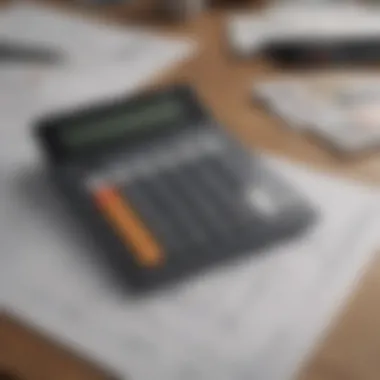 Calculator on a desk with house plans