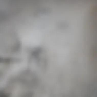 A close-up of drywall showing marked areas indicating where wires may be located.