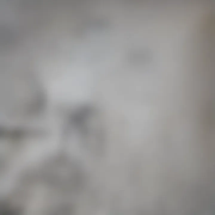 A close-up of drywall showing marked areas indicating where wires may be located.