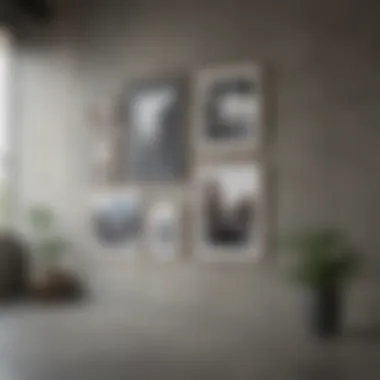 A beautifully arranged gallery wall on a concrete surface featuring various frame styles and art pieces.