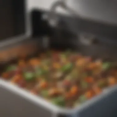 Close-up view of kitchen scraps being added to a compost bin, illustrating the importance of food waste in composting.