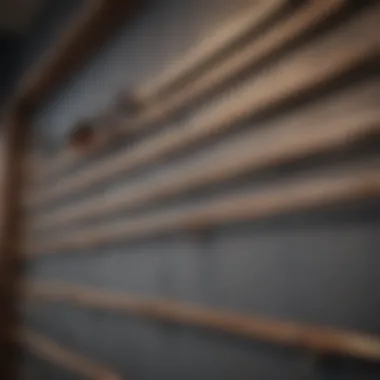 A hand selecting frame hangers from a selection on a shelf