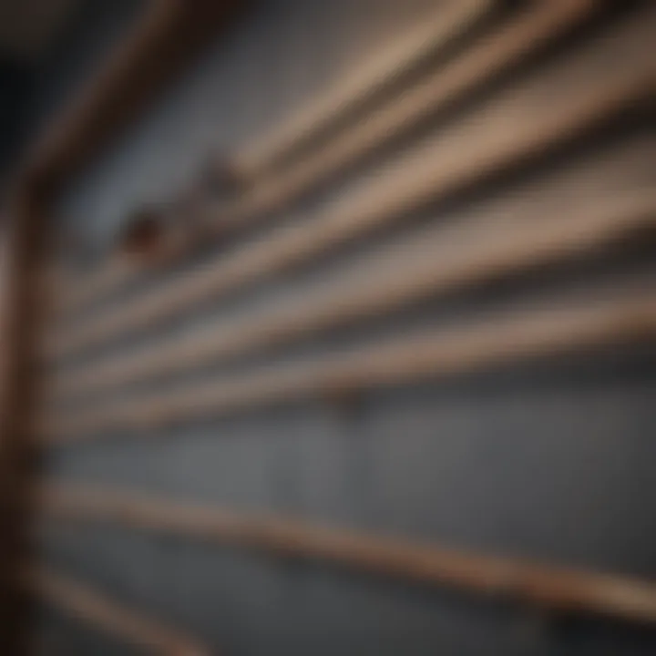 A hand selecting frame hangers from a selection on a shelf